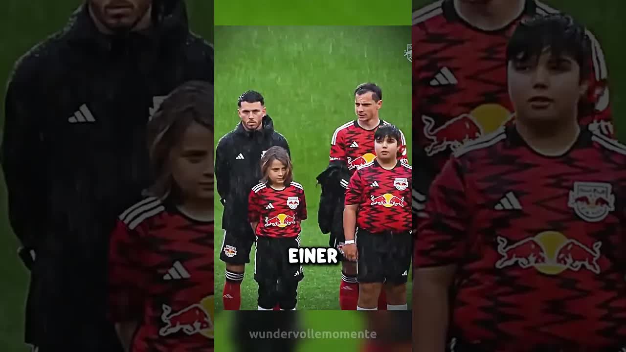 Fußballspieler geben Kindern ihre Jacken
