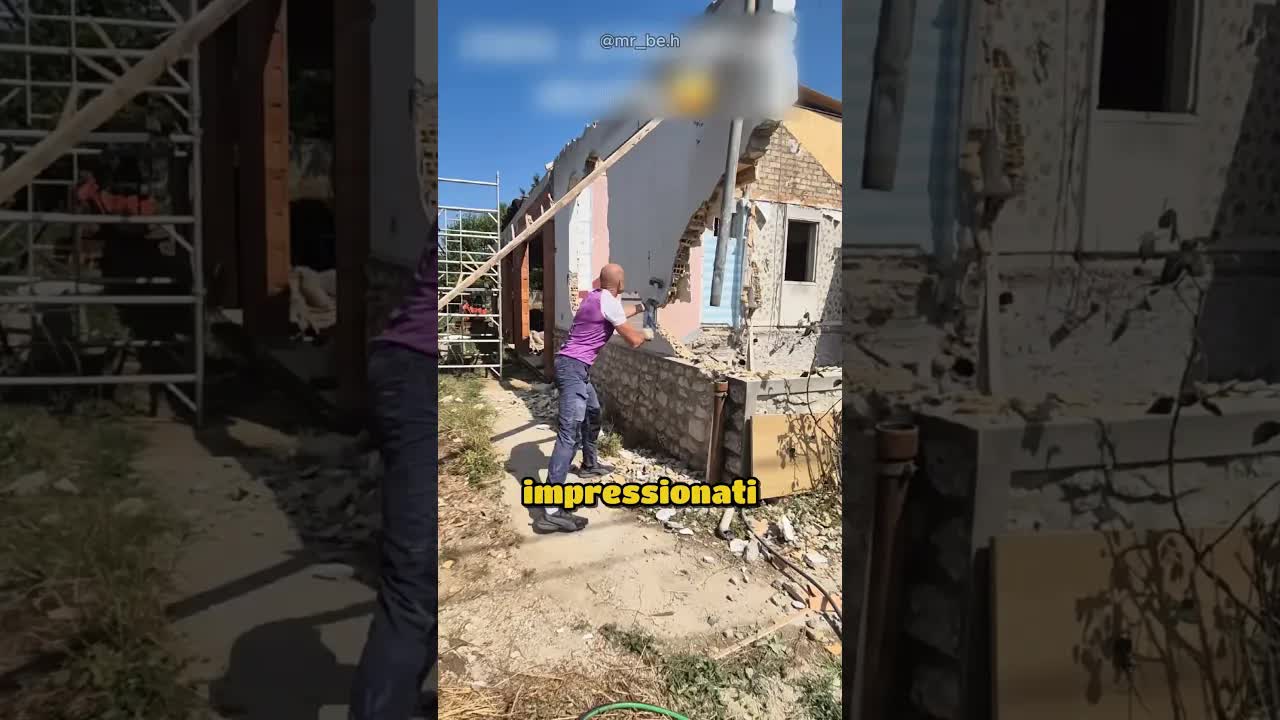 Un operaio e un muro che non crolla