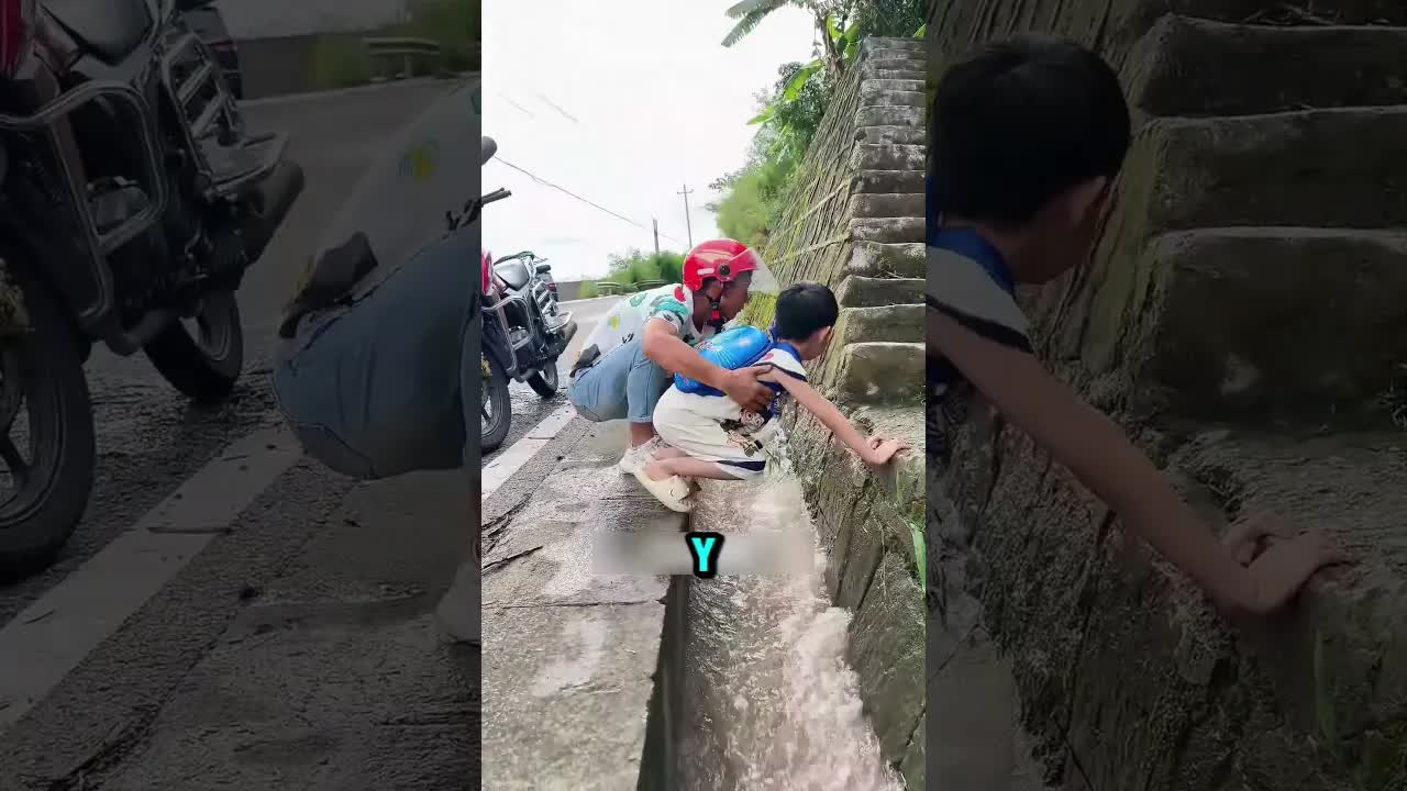 Motociclista ayuda a niño a cruzar un canal